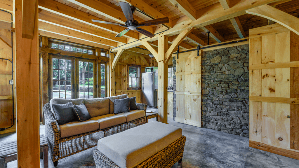 post beam style timber frame pool house northern white pine ashlar stone barn door hardware cement slab floor radiant heat katonah westchester