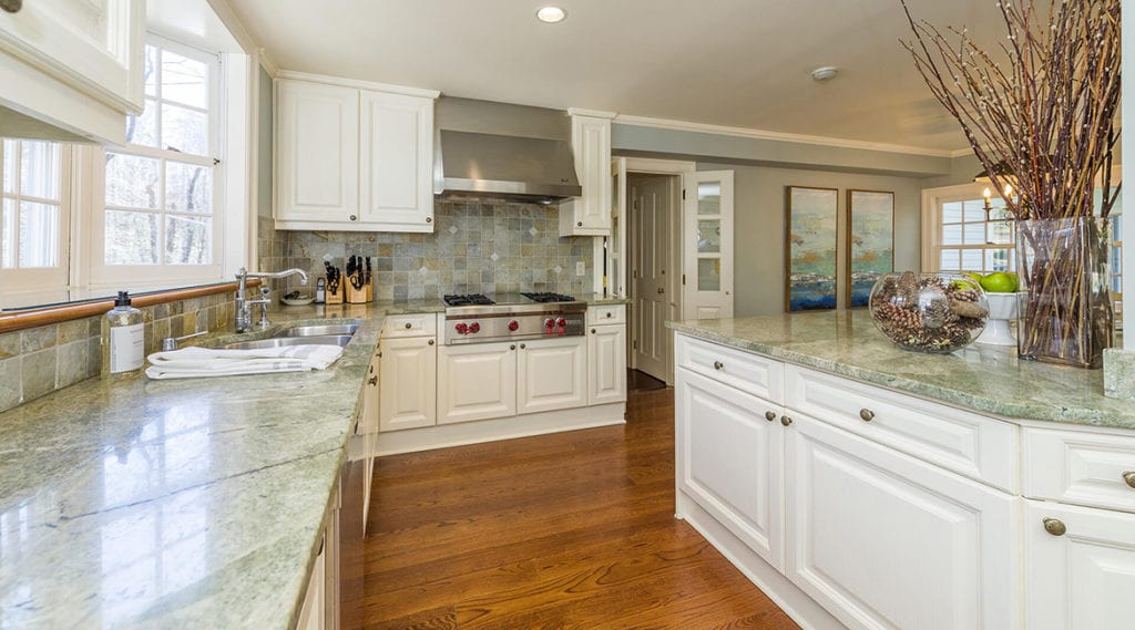 Modern-country-kitchen-with-Granite-countertop-complimenting-the-tile-backsplash-in-North-Salem-NY-