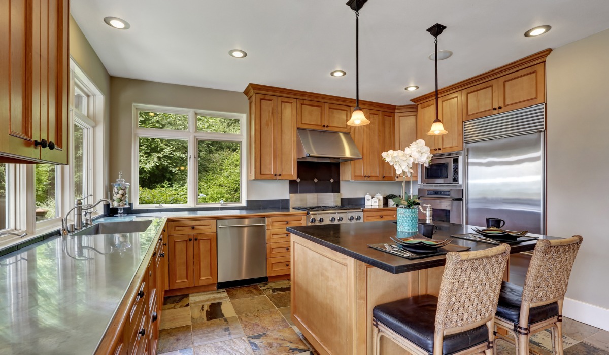spacious kitchen with natural wood cabinets
